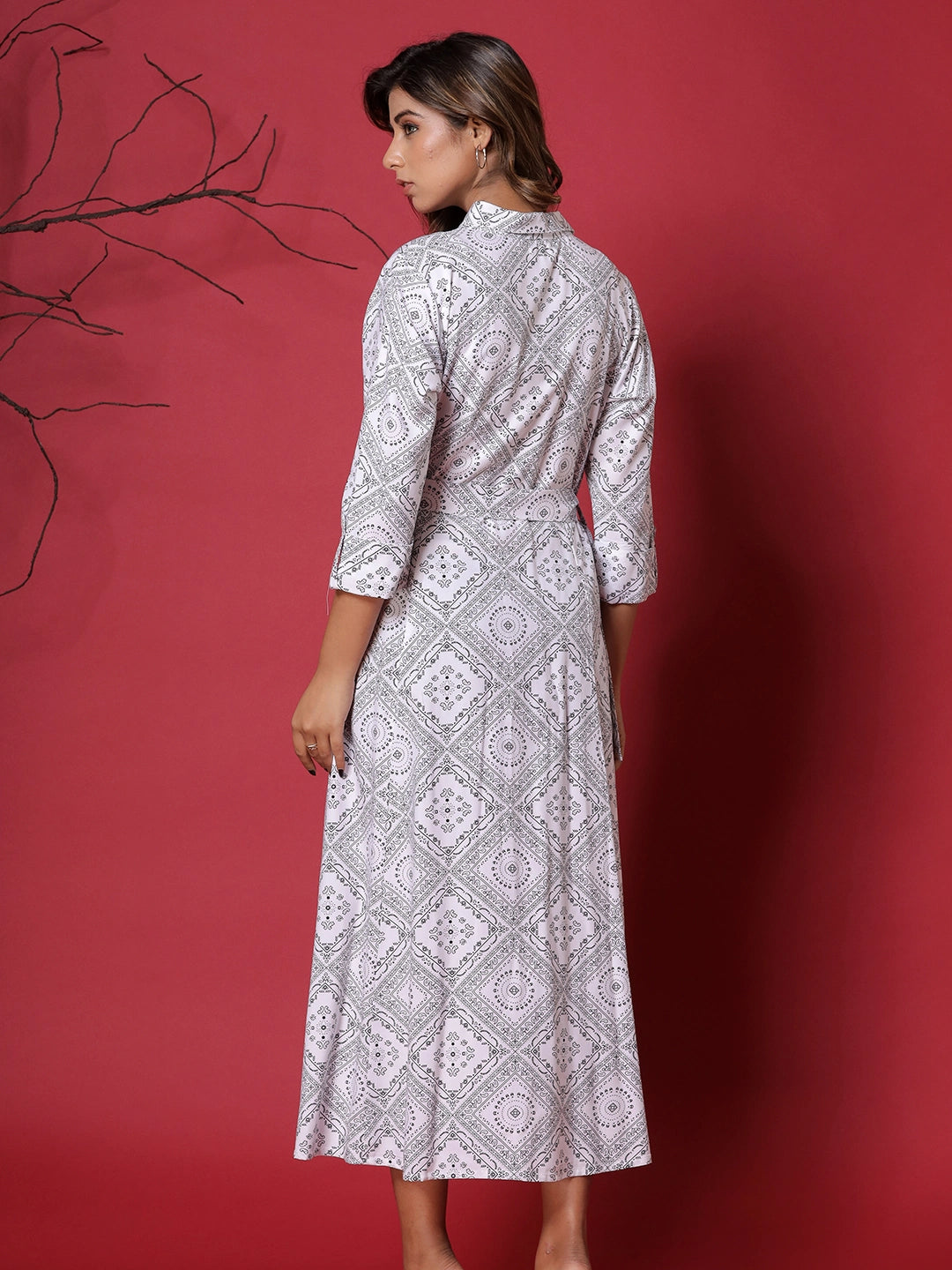 Ivory Whispers: White Printed Gown