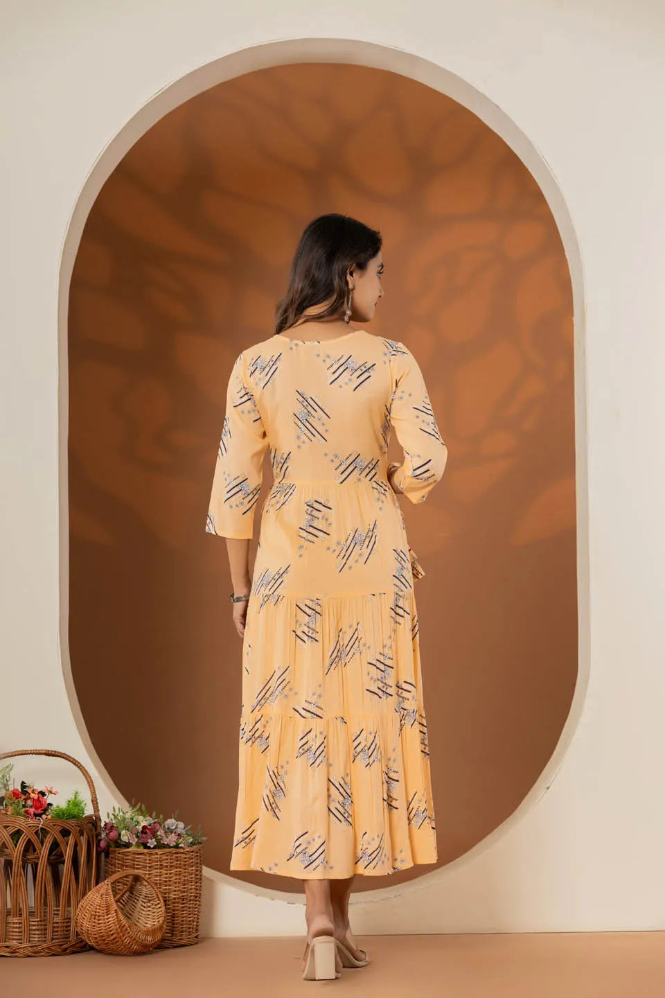 elegant pink ethnic dress with geometric print and tiered design