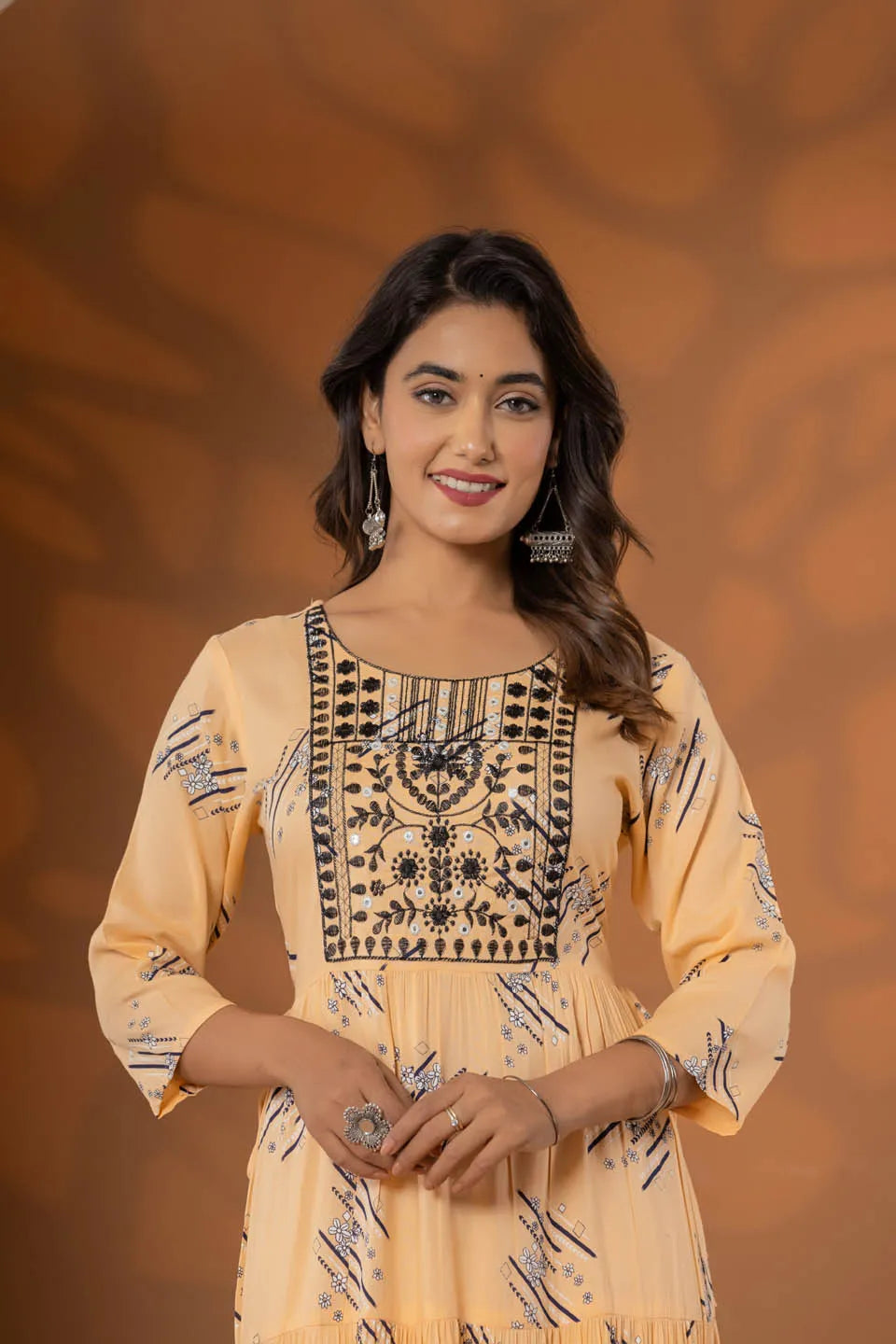elegant pink ethnic dress with geometric print and tiered design