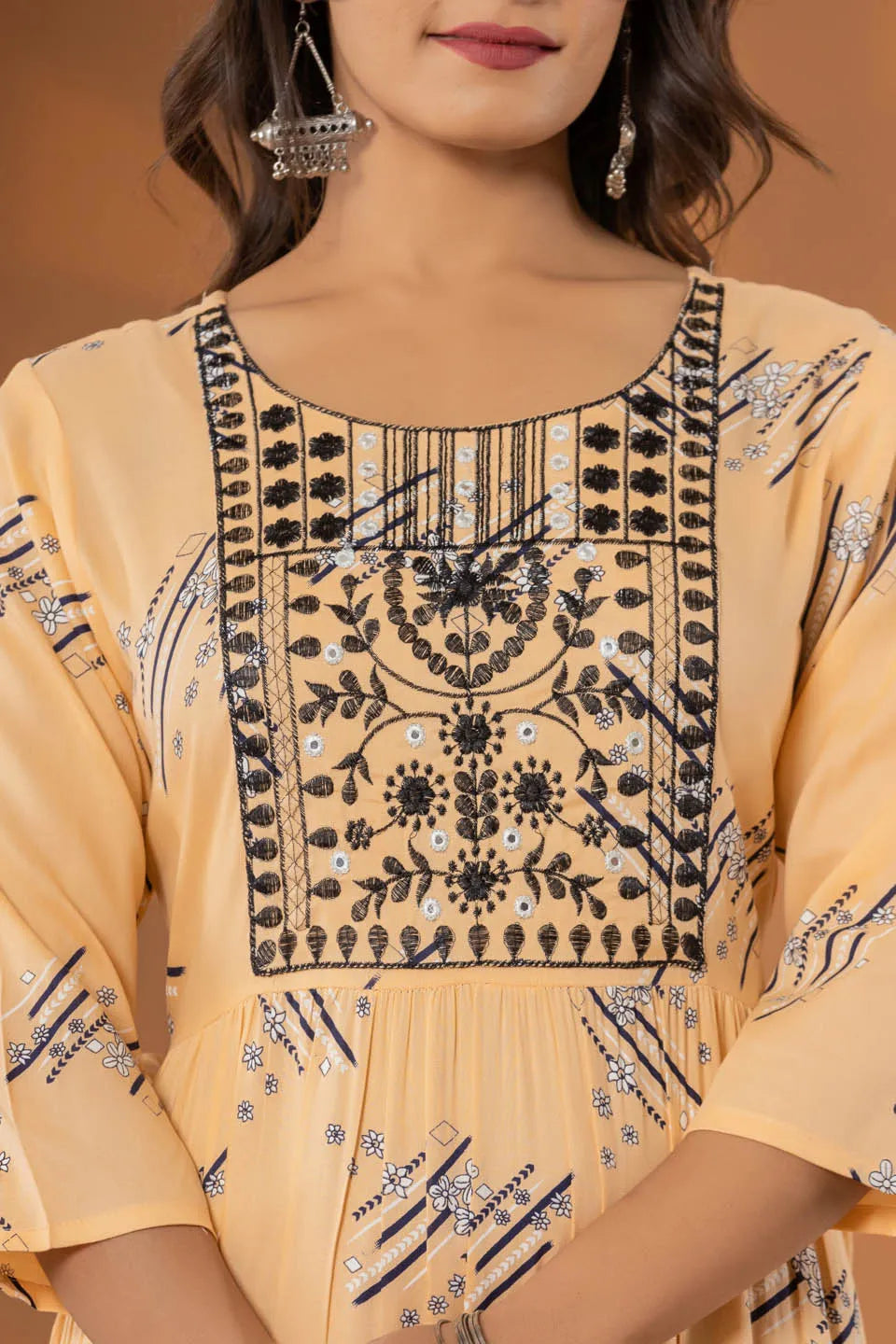 elegant pink ethnic dress with geometric print and tiered design