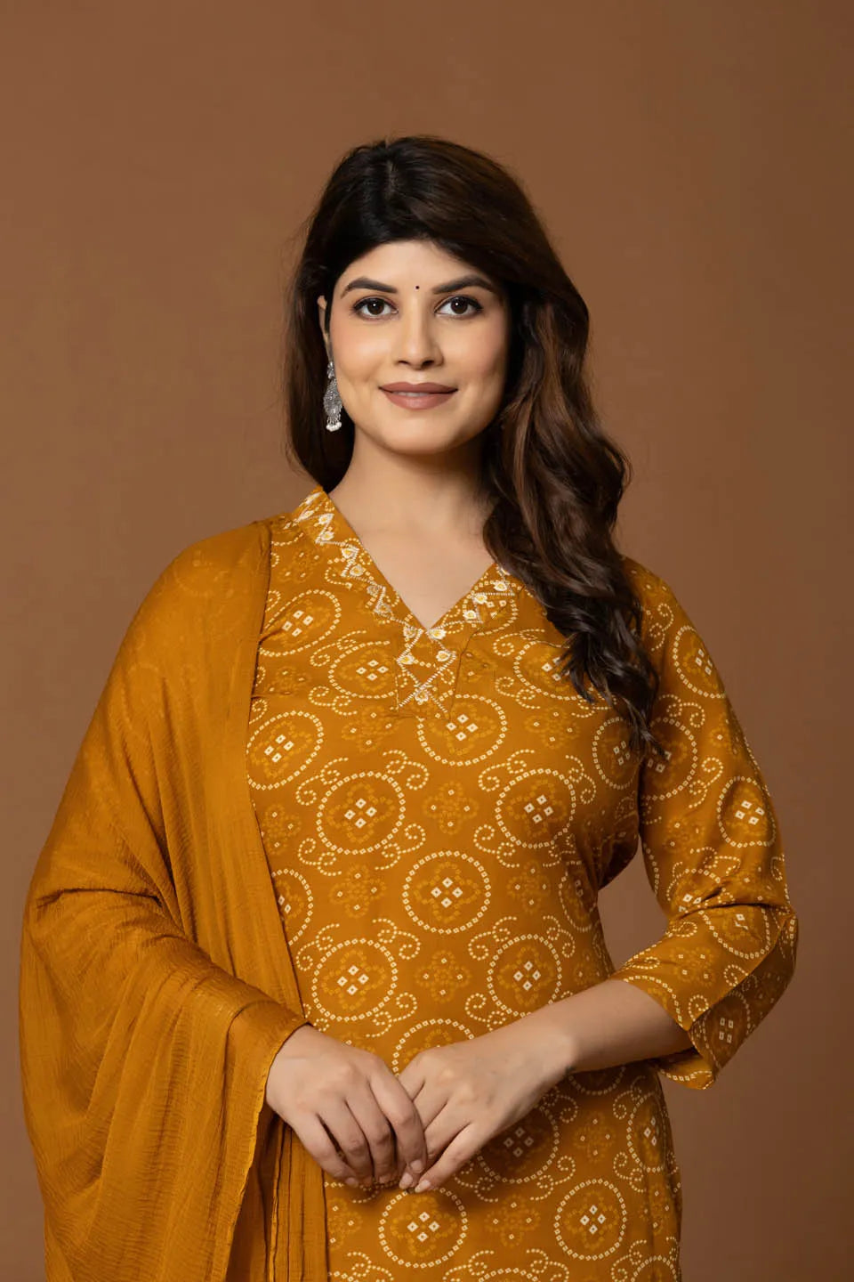mustard bandhani kurta set with geometric pants
