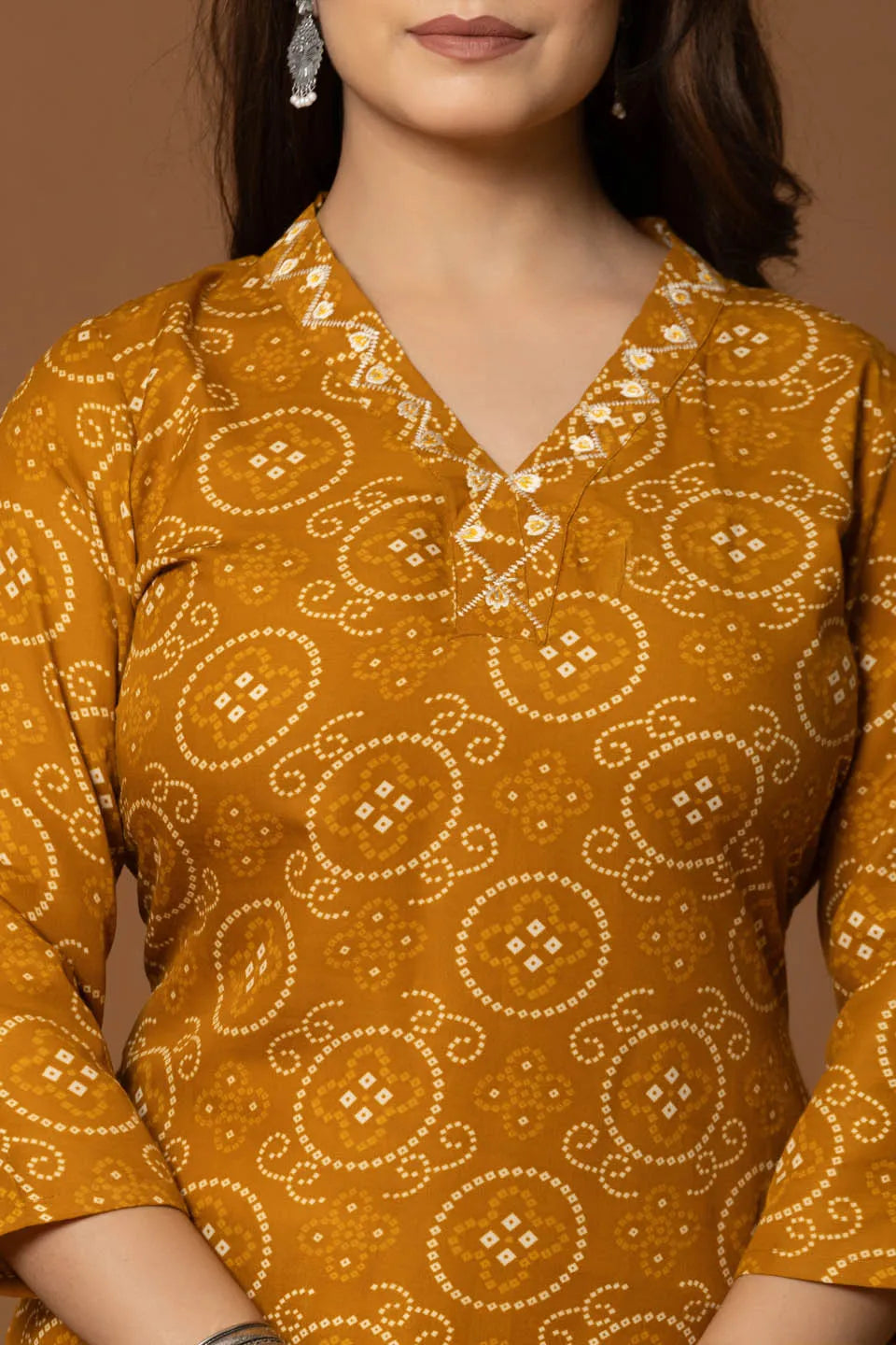 mustard bandhani kurta set with geometric pants