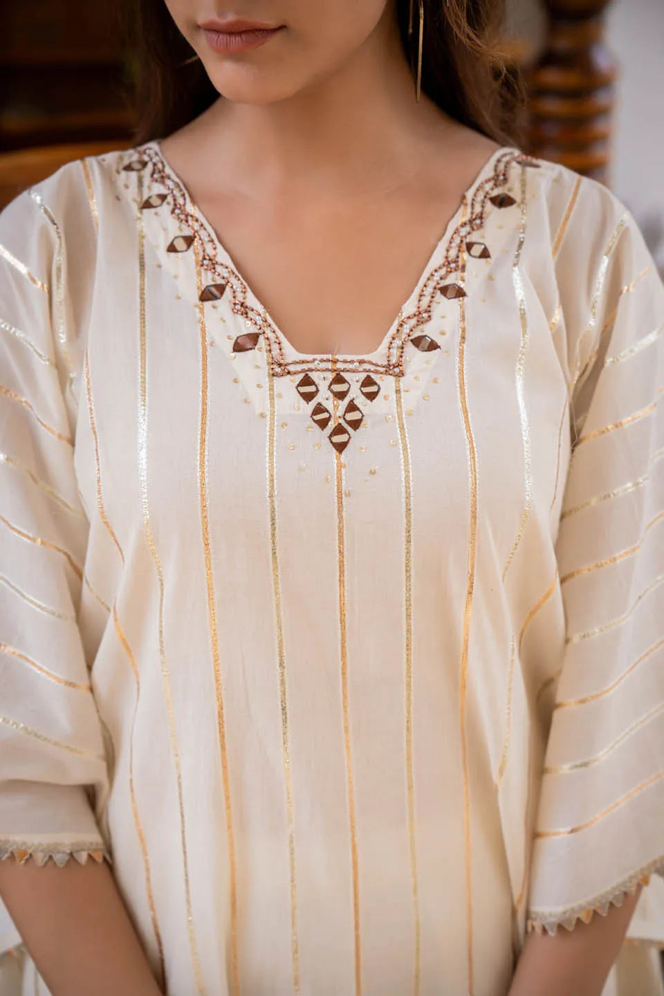 elegant kaftan style tunic with metallic stripes matching narrow pants