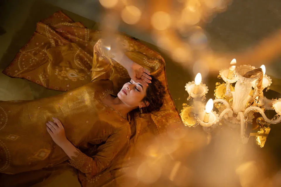 mustard yellow shimmer tissue kurta set with ethnic motifs and straight pants